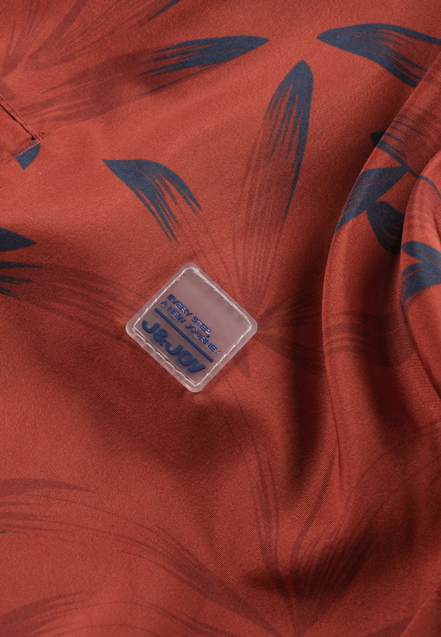 Veste homme rouille réversible avec imprimé feuilles